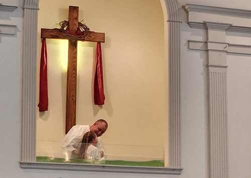 Baptism taking place at Springhill