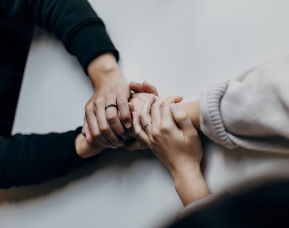 Holding hands in prayer